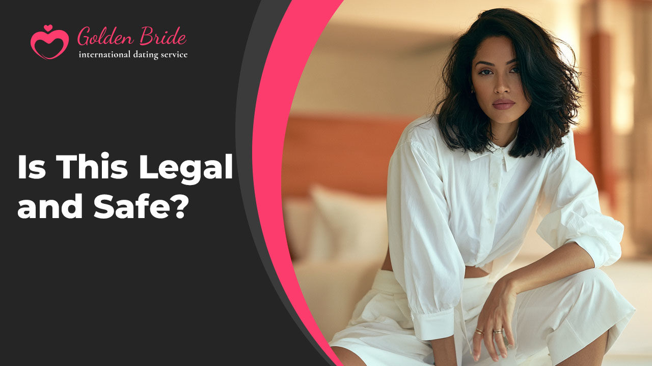 Woman with shoulder-length dark hair in a white shirt and white shorts sitting on the edge of a bed in a bright bedroom